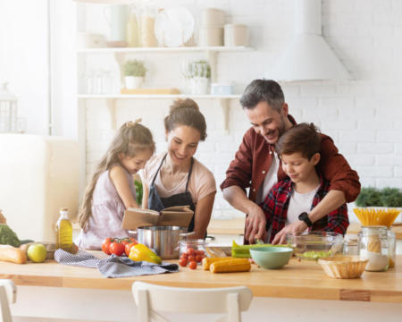 Happy family cooking together on home kitchen