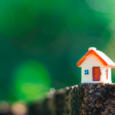 Closeup miniature house on green nature background