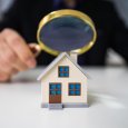 Magnifying Glass And Small House